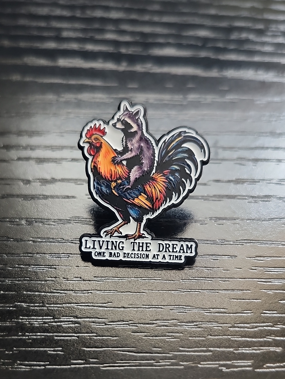 Living The Dream Raccoon on Rooster Enamel Pin - Multicolor